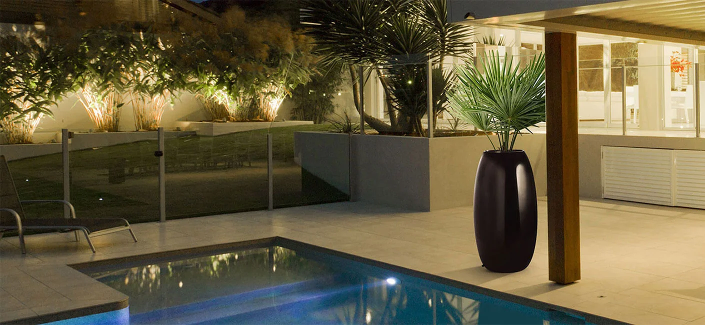 black tall FRP planter placed in the verandah