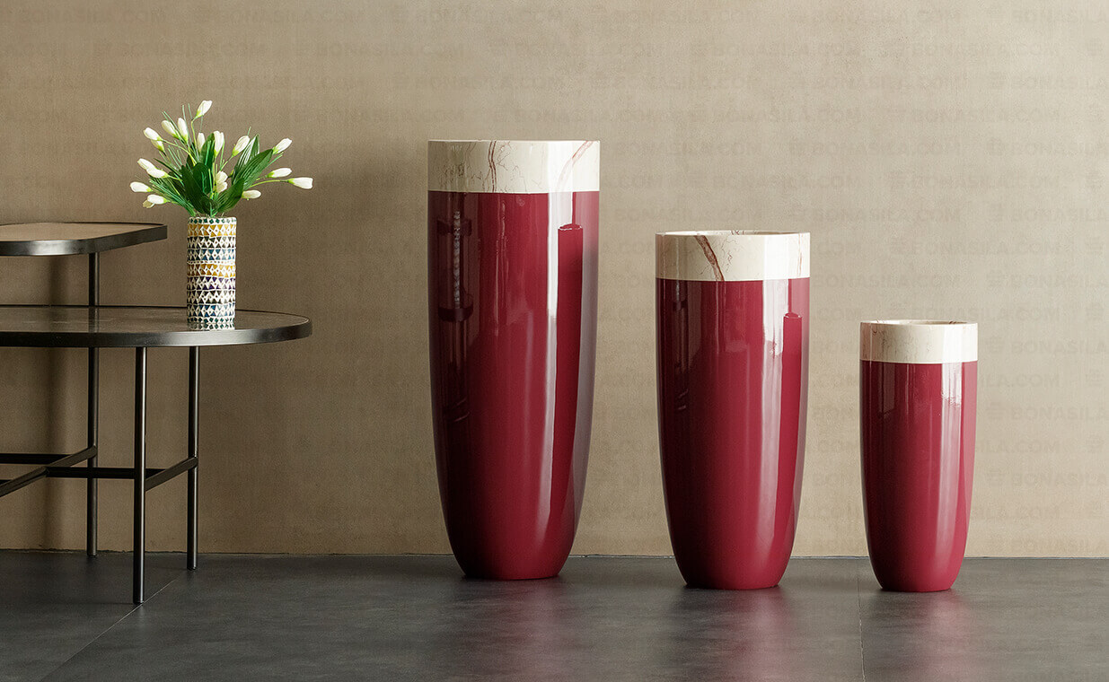 red bullet shaped tall planter